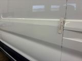 a close up of a white van with a door handle