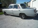 a silver car that is parked in the driveway