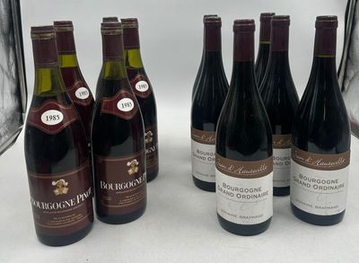 several bottles of wine are lined up on a table