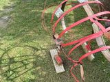 a large red object that is sitting in the grass