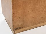 a wooden box with a handle on a white surface