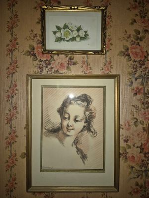 a picture of a woman that is hanging on the wall
