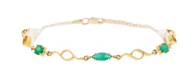 a gold bracelet with green stones on a white background