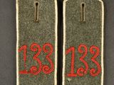 two tags with the numbers 123 and 123 on them