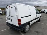 a white van that is parked in a parking lot
