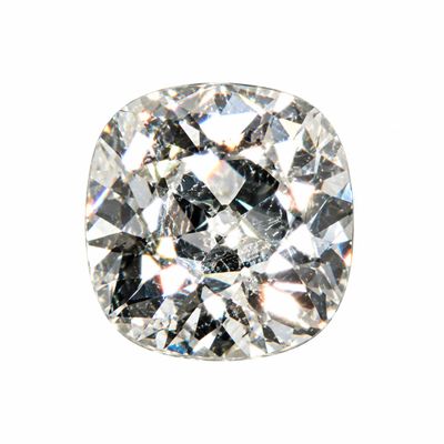 a close up of a cushion cut diamond on a white background