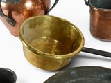 many different types of pots and pans on the table