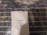 a black and white striped shirt with a tag on it