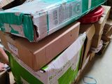 many boxes stacked on top of each other in a room