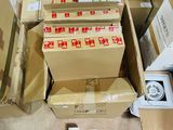 many boxes and boxes of electronic devices on the floor