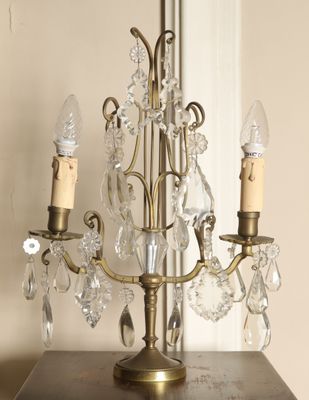 a small crystal chandelier on a wooden table