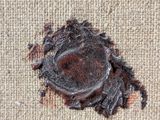a piece of fabric that has been torn off of it