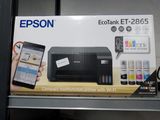 a box with a printer and a cell phone in it