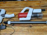 a vacuum that is sitting on a wooden table