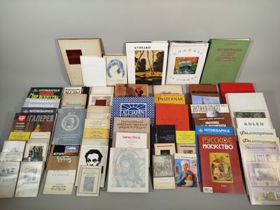 several books are stacked on top of each other on a table