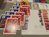a lot of stamps and postcards on a table