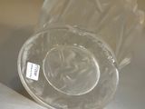 a clear glass bowl sitting on top of a table