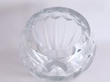 a clear glass bowl on a white surface
