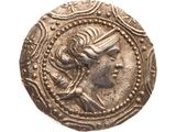 une vieille pièce de monnaie sur laquelle figure l'effigie d'une femme