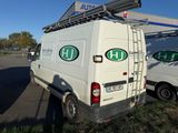 a white van that is parked in a parking lot