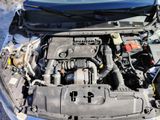 the engine of a car with its hood open and the hood open