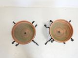 two pots that are sitting on a table