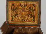 a wooden box with a decorative design on it