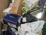 a cardboard box full of assorted items in a room