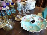 a table with a lot of dishes and glasses on it