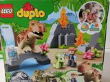 a box of lego duplo dinosaurs in the jungle