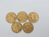 four gold sovereigns, one of which is a sovereign and the other of which is a sovereign