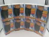 quatre paquets de collants noirs sont empilés les uns sur les autres