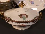 many plates and bowls that are sitting on a table