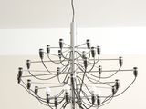 an image of a chandelier hanging from the ceiling in a living room