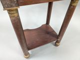 an old wooden table with a shelf on top of it