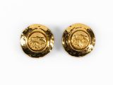 pair of gold plated earrings with a design of a lion