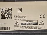 a close up of a cell phone with a qr code on the back of it