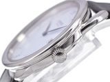 a close up of a watch on a white surface