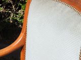 an image of a wooden chair with a white upholstered seat