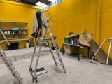 a ladder that is leaning against a wall in a room