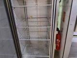 an image of a refrigerator in a kitchen with the door open