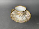 an image of a cup and saucer on a table
