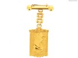 an image of a gold plated keychain with a dog on it