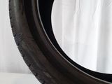 a close up of a tire on a white surface
