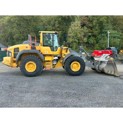 a picture of a construction vehicle parked in a parking lot