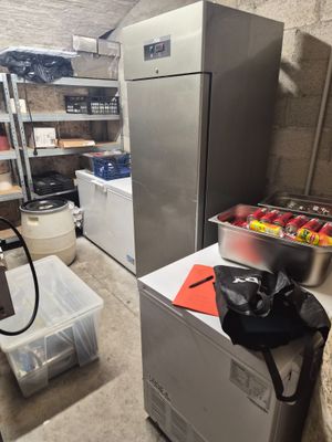 an image of a kitchen with a refrigerator and freezer
