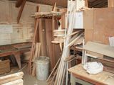 several pieces of wood are stacked on top of each other in a room