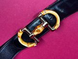 an image of a black leather belt with a gold buckle