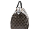a brown and black handbag on a white background