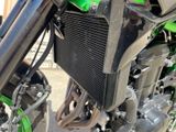 a close up of a motorcycle with a radiator on it
